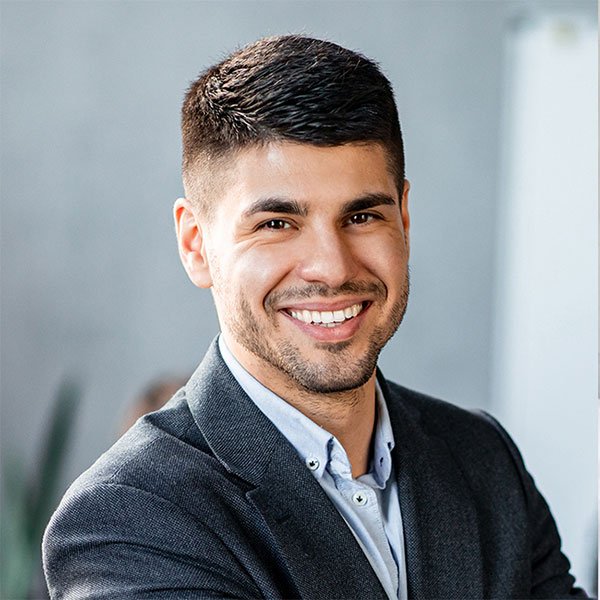 Smiling young professional man portrait for business, corporate, and career profile use.